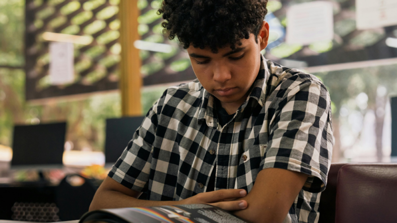 Teen reading book